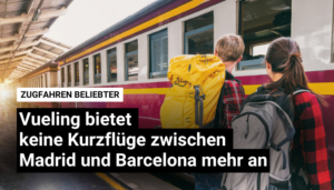 Zwei Backpacker schauen einem Zug beim Einfahren zu